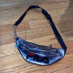 This is a silver FILA bag with 3 pockets.